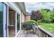 Wooden deck with railing, offering a view of the backyard and surrounding greenery at 11385 Donnington Dr, Duluth, GA 30097