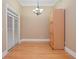 Dining room features hardwood floors, modern chandelier, and natural light at 11385 Donnington Dr, Duluth, GA 30097