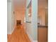 Hallway offers hardwood floors and an open concept, with a view of the brick fireplace at 11385 Donnington Dr, Duluth, GA 30097