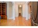 Bright and spacious hallway with columns and hardwood floors, leading to rooms at 11385 Donnington Dr, Duluth, GA 30097