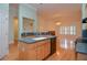 View of island with sink, dishwasher, and cabinets in the open floor plan at 11385 Donnington Dr, Duluth, GA 30097