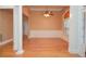 Spacious living room with columns, neutral paint, and a bright window at 11385 Donnington Dr, Duluth, GA 30097