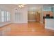 Spacious living room with hardwood floors, bright windows and neutral paint at 11385 Donnington Dr, Duluth, GA 30097