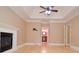 Spacious bedroom boasts fireplace, hardwood floors, and en-suite bathroom access at 11385 Donnington Dr, Duluth, GA 30097