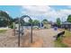 A community playground area with swings and play equipment on a mulch base at 11385 Donnington Dr, Duluth, GA 30097