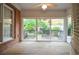Bright sunroom with a deck and view of the backyard through sliding glass doors at 11385 Donnington Dr, Duluth, GA 30097