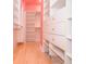 Bright walk-in closet features custom shelving and plenty of storage space at 11385 Donnington Dr, Duluth, GA 30097