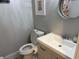 Clean bathroom with modern toilet and vanity at 23 Poplar St, Porterdale, GA 30014