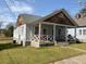 Charming home with inviting front porch, perfect for relaxing in the neighborhood at 23 Poplar St, Porterdale, GA 30014