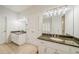 Bathroom with dual sinks, granite countertops, white cabinets, and tile flooring at 3968 Belle Glade Ct, Snellville, GA 30039