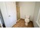 Clean bathroom with tiled floors, glass shower, and standard toilet at 3968 Belle Glade Ct, Snellville, GA 30039
