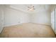 Large bedroom with tray ceiling, neutral carpeting and shuttered windows at 3968 Belle Glade Ct, Snellville, GA 30039