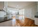 Bright, neutral kitchen with stainless steel appliances, white cabinets, and hardwood floors at 3968 Belle Glade Ct, Snellville, GA 30039