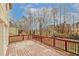 Wooden back deck overlooking wooded backyard with nearby houses at 4161 Windermere Dr, Lithonia, GA 30038