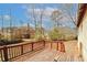 Wooden back deck overlooking wooded backyard with houses at 4161 Windermere Dr, Lithonia, GA 30038