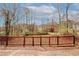 Wooden back deck overlooking wooded backyard with nearby houses at 4161 Windermere Dr, Lithonia, GA 30038