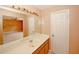 Bathroom vanity and mirror with doorway access to an adjoining bedroom at 4161 Windermere Dr, Lithonia, GA 30038