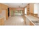 Open kitchen featuring tile flooring and easy access to the living room at 4161 Windermere Dr, Lithonia, GA 30038