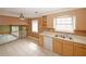 Open kitchen featuring tile flooring, beige cabinets, and modern appliances at 4161 Windermere Dr, Lithonia, GA 30038