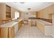 Kitchen featuring ample countertop space, tiled flooring, and a mosaic backsplash at 4161 Windermere Dr, Lithonia, GA 30038