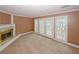 Spacious living room with a fireplace and inviting French doors leading to additional spaces at 4161 Windermere Dr, Lithonia, GA 30038