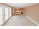 Large living room with access to other rooms, and featuring French doors and carpeted floors at 4161 Windermere Dr, Lithonia, GA 30038