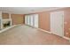 Large living room with a cozy fireplace and access to a sunroom through elegant French doors at 4161 Windermere Dr, Lithonia, GA 30038