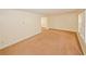 Bright living room with neutral paint and carpet, featuring large windows for natural light at 4161 Windermere Dr, Lithonia, GA 30038