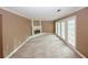 Bright living room showcasing a fireplace and french doors, offering both comfort and style at 4161 Windermere Dr, Lithonia, GA 30038