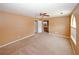 Large main bedroom with a ceiling fan, connected bathroom, and a bright window at 4161 Windermere Dr, Lithonia, GA 30038