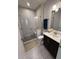 Modern bathroom features a glass shower and dark-stained vanity at 323 Concord St, Alpharetta, GA 30009
