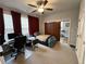 Bedroom features a work desk, a bed, neutral carpet, and closet at 323 Concord St, Alpharetta, GA 30009