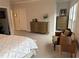 Spacious bedroom featuring a large bed, sitting area, and ample natural light at 323 Concord St, Alpharetta, GA 30009