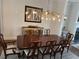 Elegant dining room featuring hardwood table, ornate chandelier, and sophisticated decor at 323 Concord St, Alpharetta, GA 30009