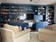 Spacious living area with custom built-ins, work space, and comfortable seating at 323 Concord St, Alpharetta, GA 30009