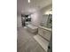 Luxurious main bathroom with freestanding tub, double vanity, and glass-enclosed shower at 323 Concord St, Alpharetta, GA 30009