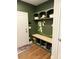 Mudroom features custom storage cubbies, bench seating, and decorative flower mural at 323 Concord St, Alpharetta, GA 30009