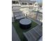 Charming outdoor deck with comfortable lounge furniture, synthetic turf, and scenic neighborhood views at 323 Concord St, Alpharetta, GA 30009