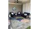 Relaxing outdoor patio featuring comfortable seating, stylish rug, and covered ceiling at 323 Concord St, Alpharetta, GA 30009
