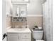 Charming bathroom with white fixtures, a shower curtain and above-toilet storage at 3648 Woodstream Ne Cir, Brookhaven, GA 30319