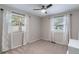 Bedroom with carpet, two windows with coverings and a ceiling fan at 3648 Woodstream Ne Cir, Brookhaven, GA 30319