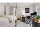 Bedroom with a four-poster bed and a workspace complete with a desk and monitors at 402 Bainbridge Dr, Atlanta, GA 30327