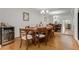 Elegant dining room featuring a large mirror, hardwood floors and a wine cooler at 402 Bainbridge Dr, Atlanta, GA 30327