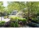 Multi-Gathering home nestled amongst mature trees with lush landscaping and ample parking at 402 Bainbridge Dr, Atlanta, GA 30327