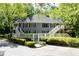 An inviting multi-Gathering home featuring traditional architecture and well-manicured landscaping at 402 Bainbridge Dr, Atlanta, GA 30327