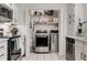 Convenient kitchen laundry closet with stainless steel washer and dryer and extra storage space at 402 Bainbridge Dr, Atlanta, GA 30327
