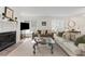 Inviting living room featuring hardwood floors, a fireplace, and comfortable seating arrangements, perfect for relaxation at 402 Bainbridge Dr, Atlanta, GA 30327