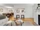 View of the living room with hardwood floors, looking into the kitchen and dining area, offering an open concept layout at 402 Bainbridge Dr, Atlanta, GA 30327