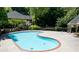 A beautiful community pool with lounge furniture and well maintained landscaping at 402 Bainbridge Dr, Atlanta, GA 30327