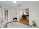Cozy sun room with hardwood floors, neutral walls, and an open doorway to other rooms, offering a warm and inviting atmosphere at 402 Bainbridge Dr, Atlanta, GA 30327